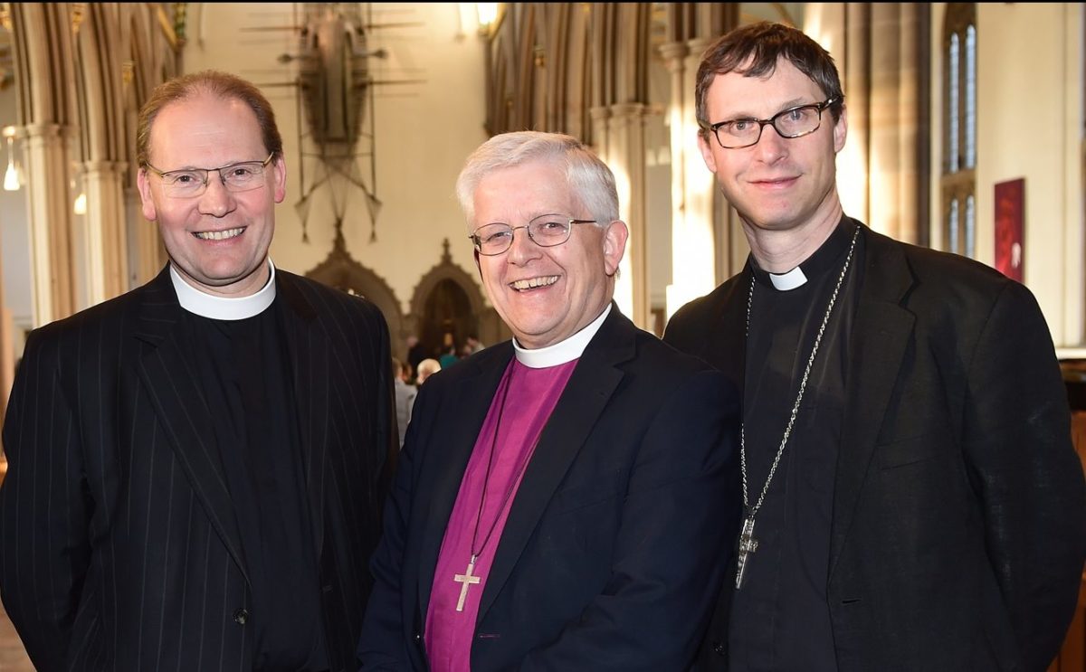 The Dean and Bishops of Blackburn Cathedral, smiling at the camera